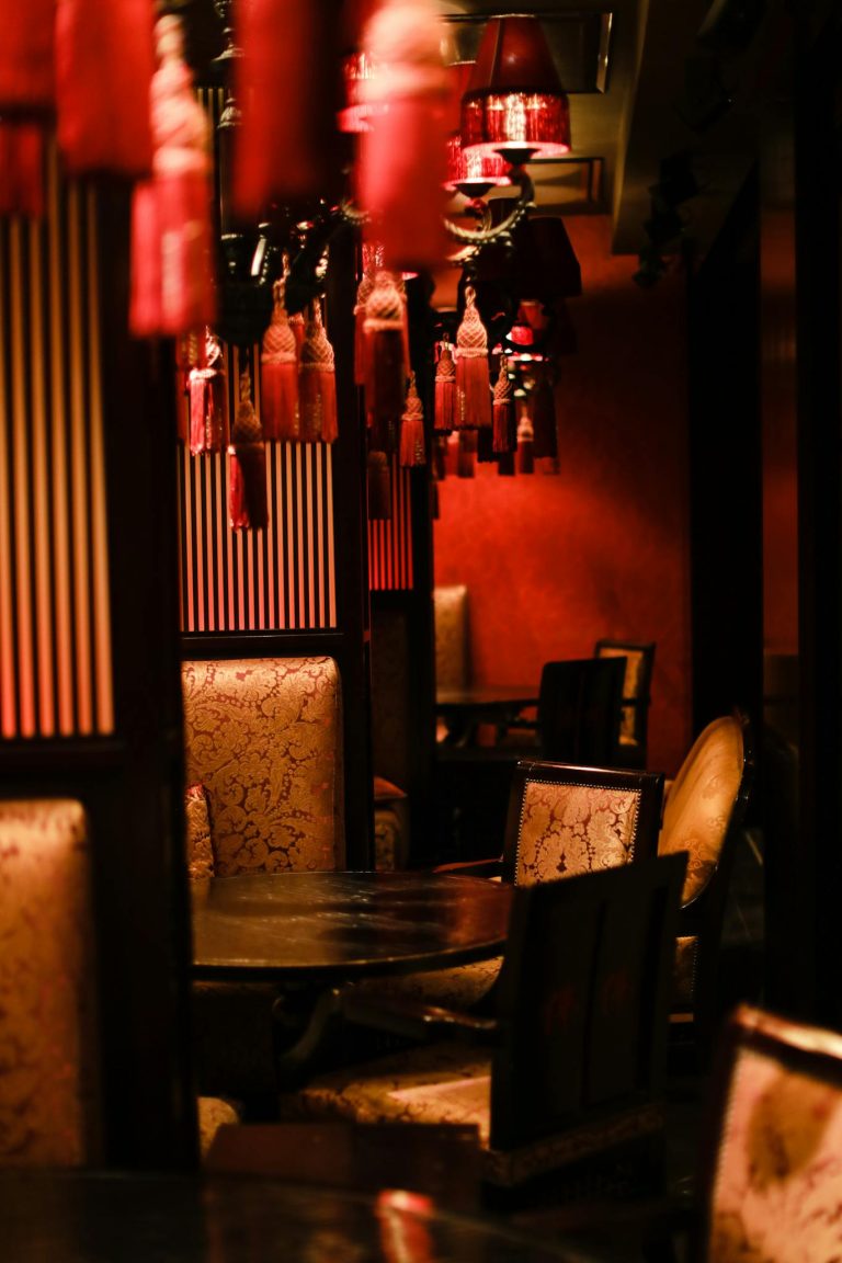 A luxurious oriental-themed restaurant interior with warm lighting and stylish decor.